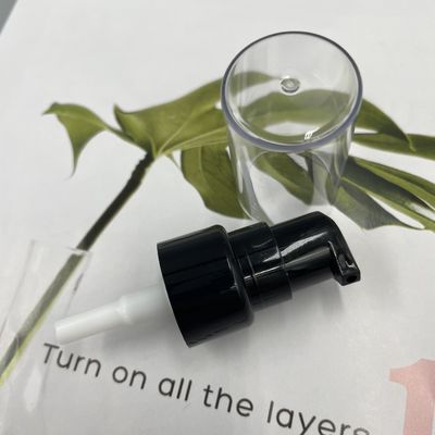 PP Black Cream Pump Dispenser 20/410 304H Smooth Closure 0.2ML/T With Full Clear Cap